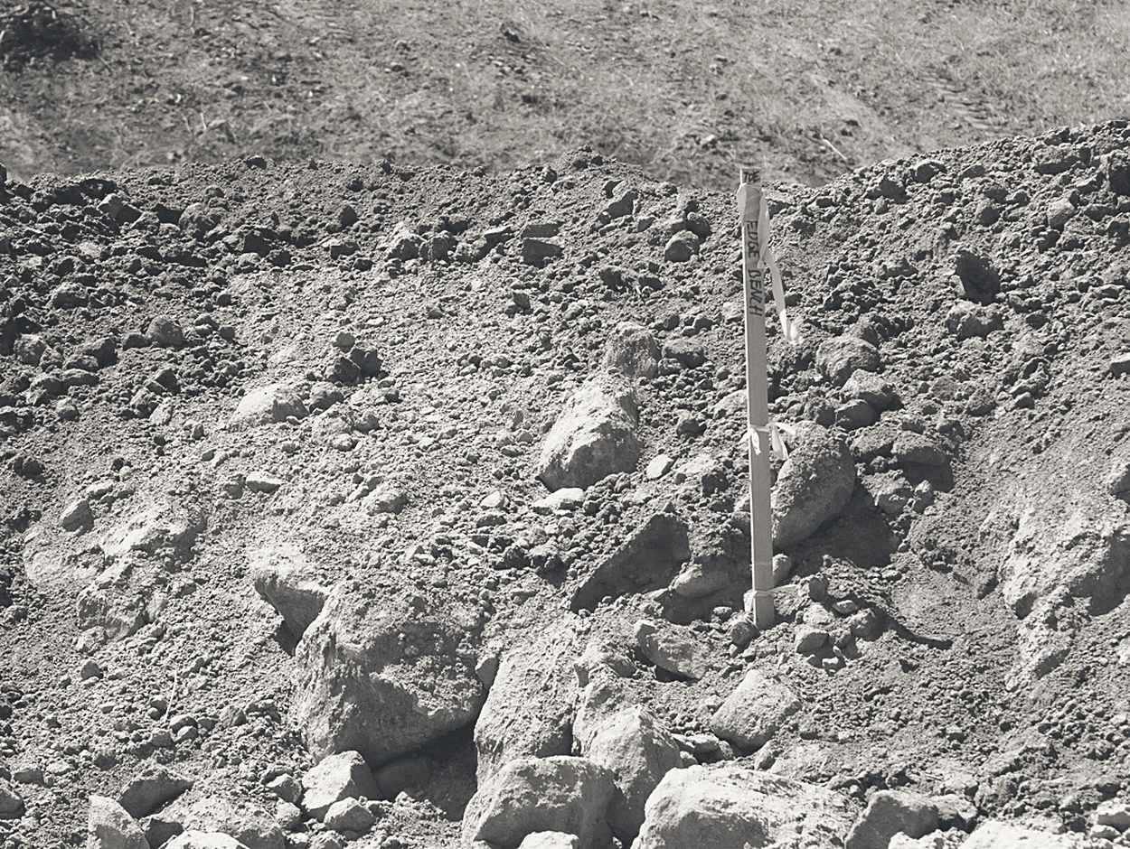Survey lath set in raw ground